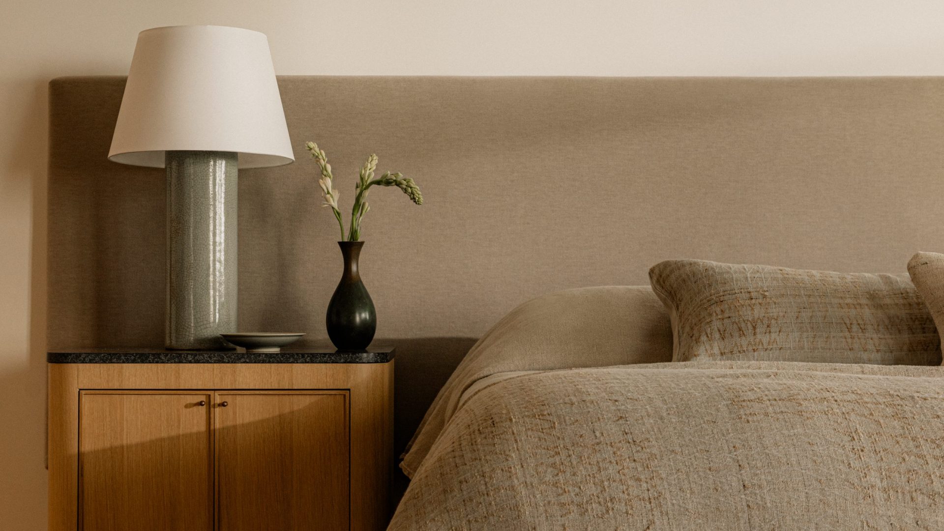 Linea Del Cielo, Rancho Santa Fe — bedroom with an upholstered headboard and layered linen