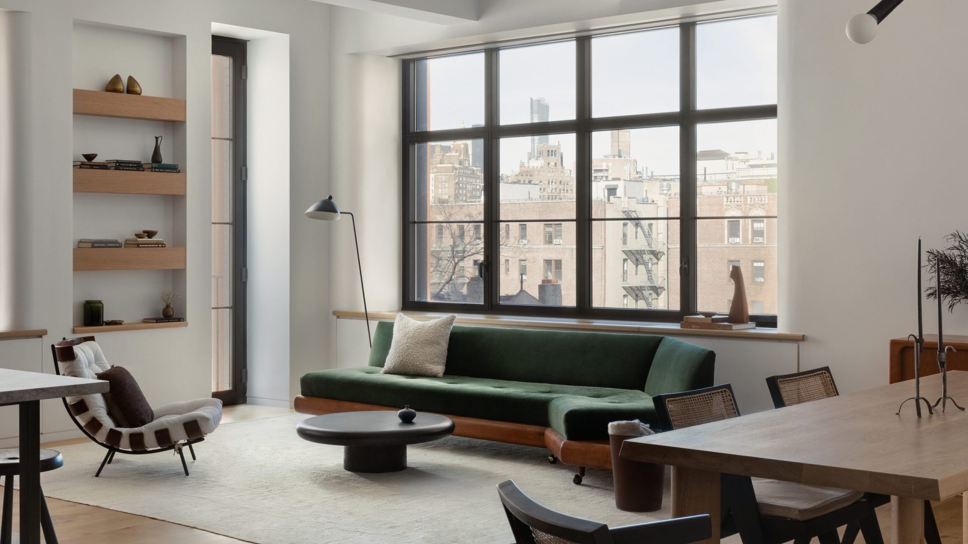 Morton Street, New York — living room with a green sofa and steel casement windows